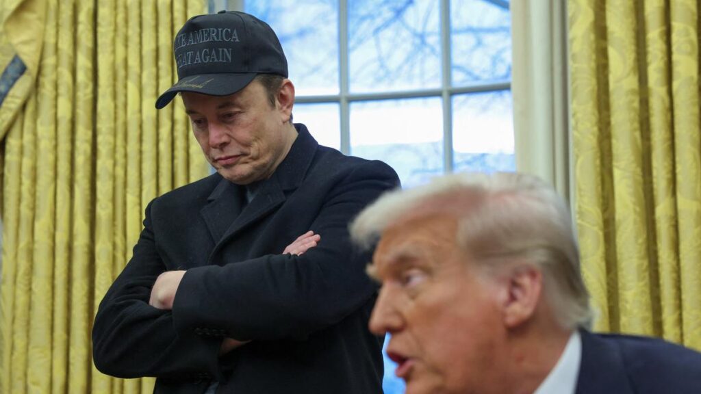 Elon Musk listens to U.S. President Donald Trump_Photo Credit_Reuters
